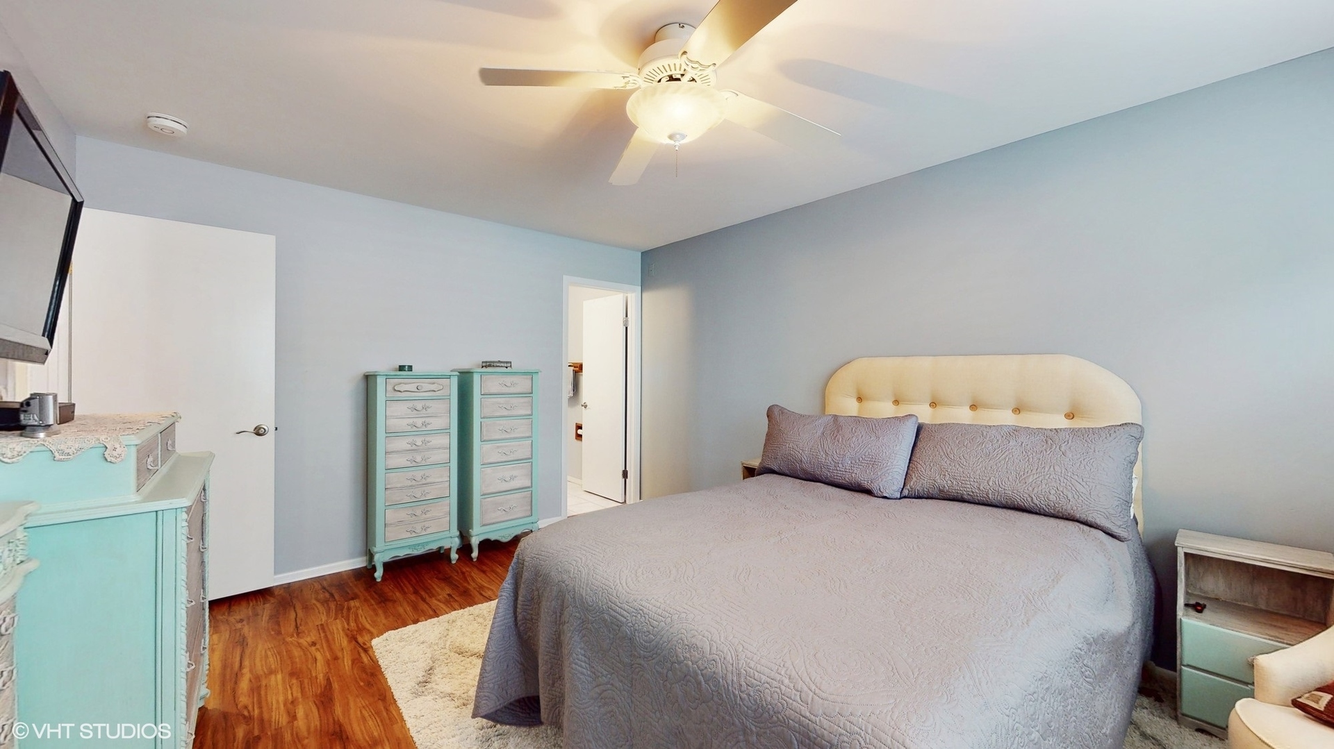 48 Lloyd Street Cary, IL 60013 - Photo 26 of 62 a bedroom with a bed and a chandelier