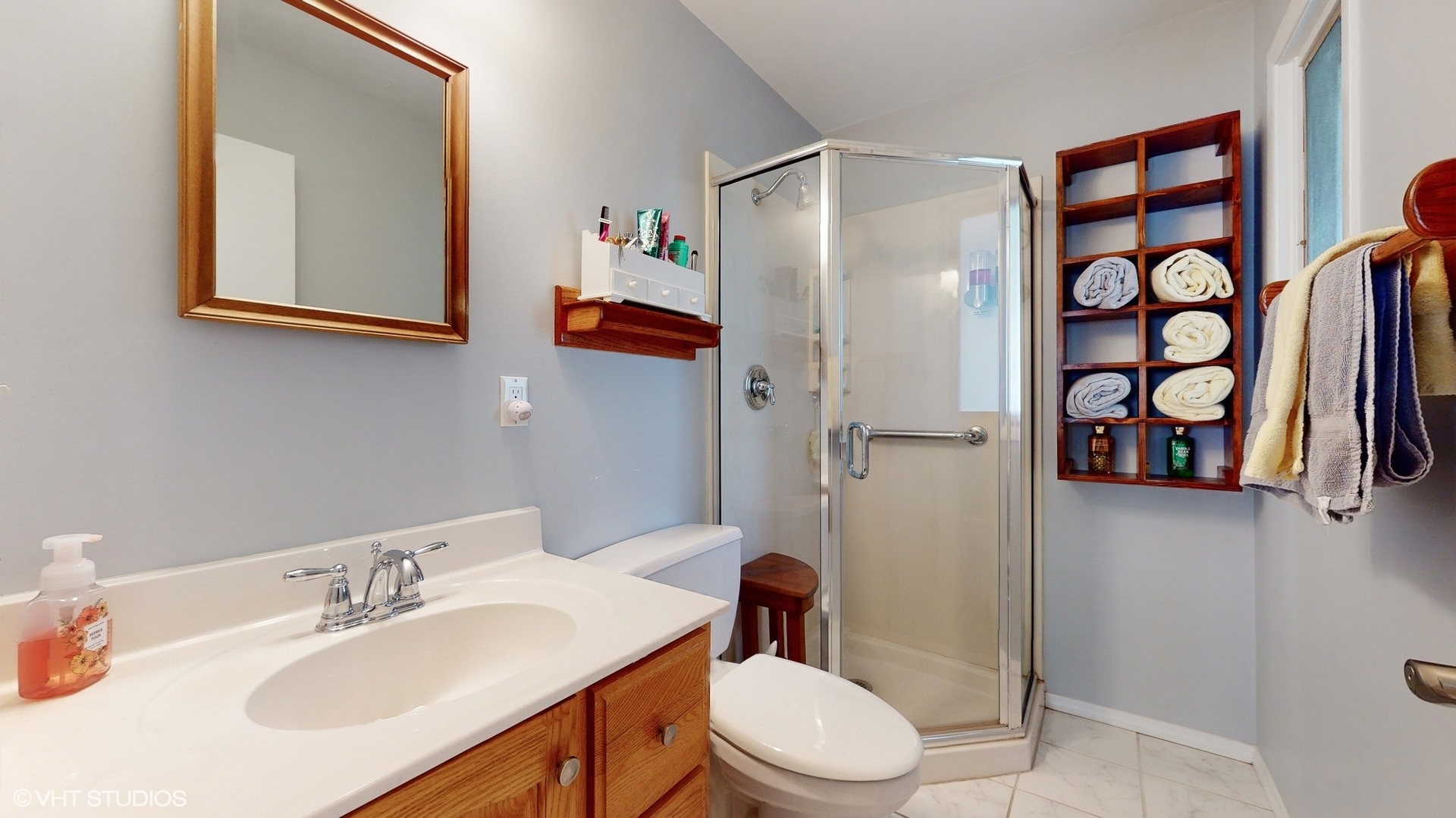 48 Lloyd Street Cary, IL 60013 - Photo 27 of 62 a bathroom with a sink toilet and shower