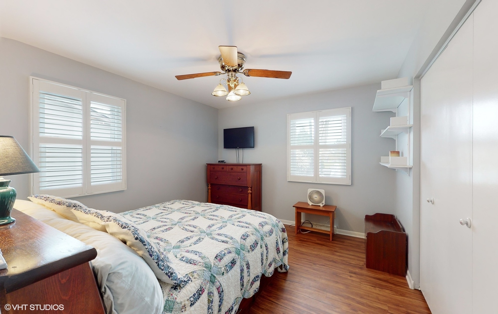 48 Lloyd Street Cary, IL 60013 - Photo 30 of 62 a bedroom with a bed and a chandelier