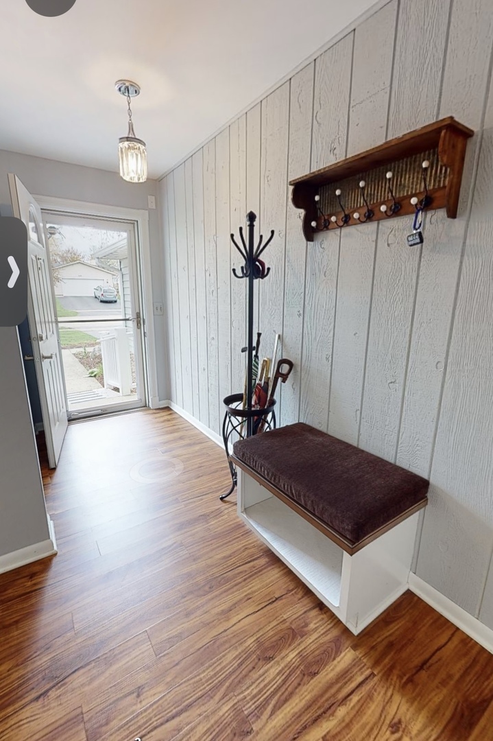 48 Lloyd Street Cary, IL 60013 - Photo 3 of 62 a view of hallway with furniture and wooden floor