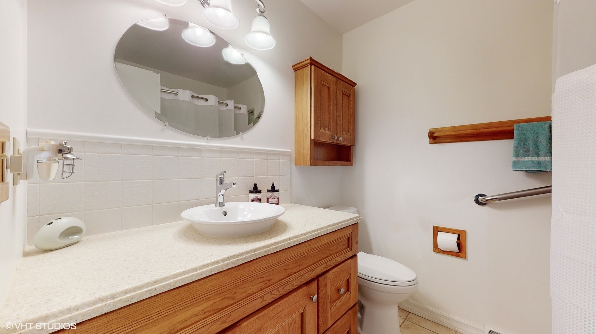48 Lloyd Street Cary, IL 60013 - Photo 31 of 62 a bathroom with a sink vanity mirror and toilet