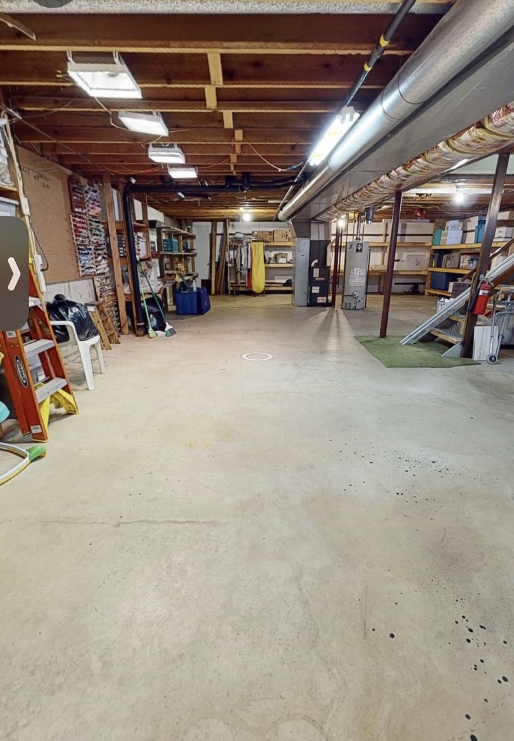 48 Lloyd Street Cary, IL 60013 - Photo 37 of 62 a view of parking garage with cars