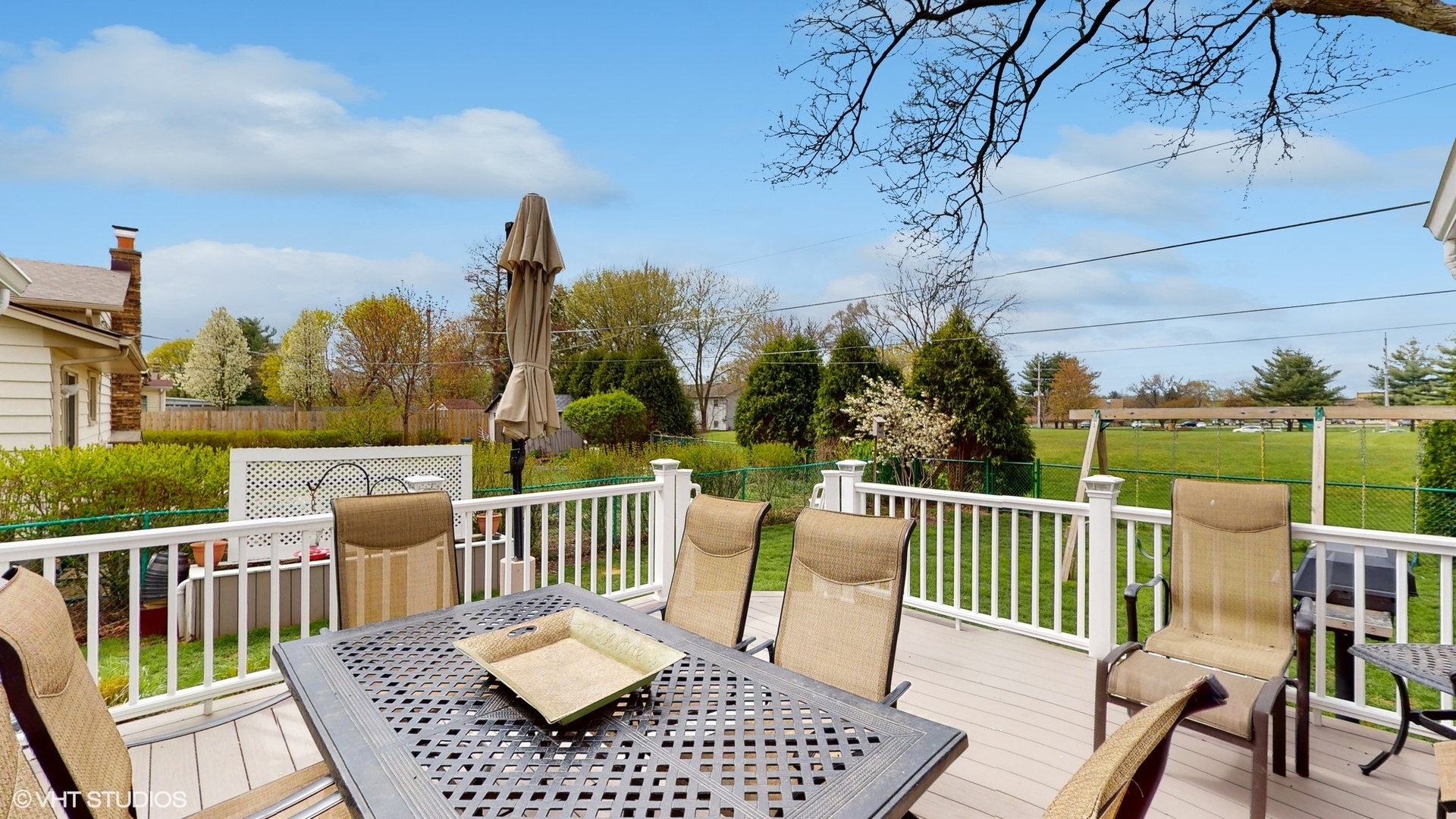 48 Lloyd Street Cary, IL 60013 - Photo 44 of 62 a view of a chairs and table on the deck