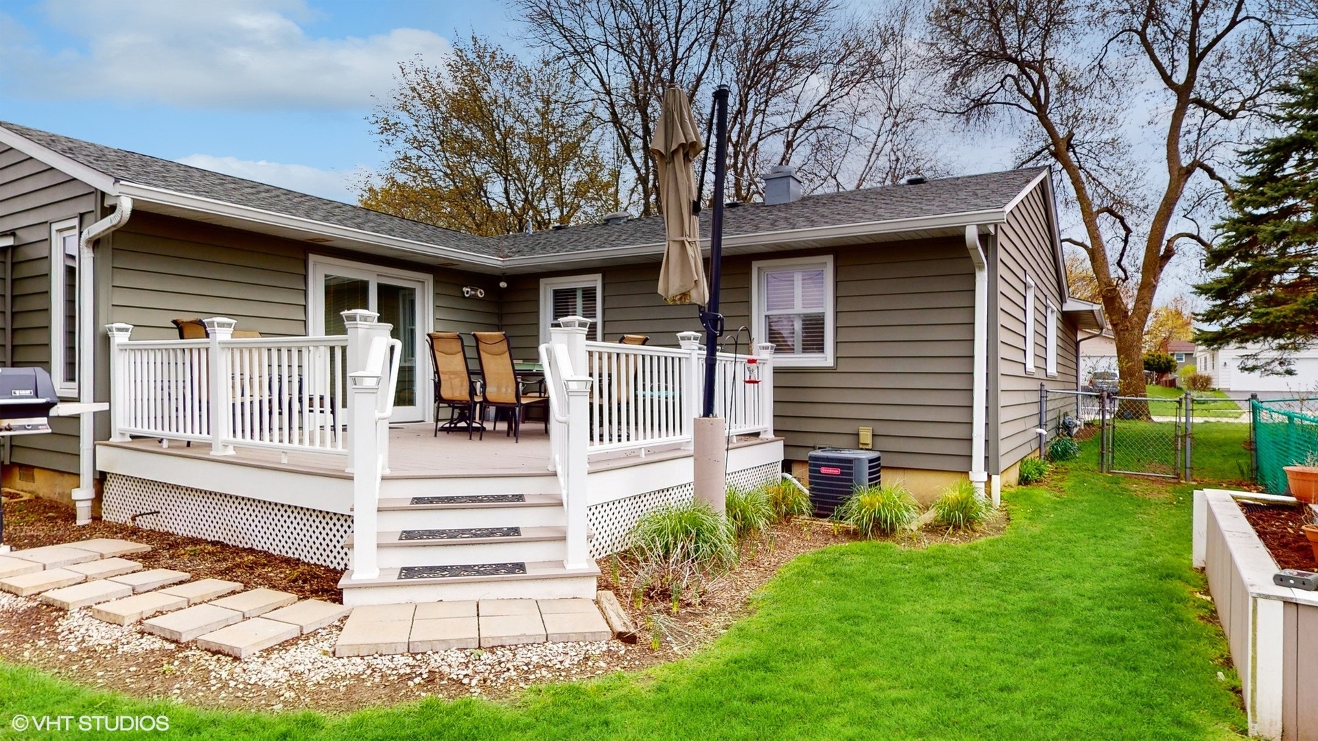 48 Lloyd Street Cary, IL 60013 - Photo 45 of 62 a front view of a house with garden
