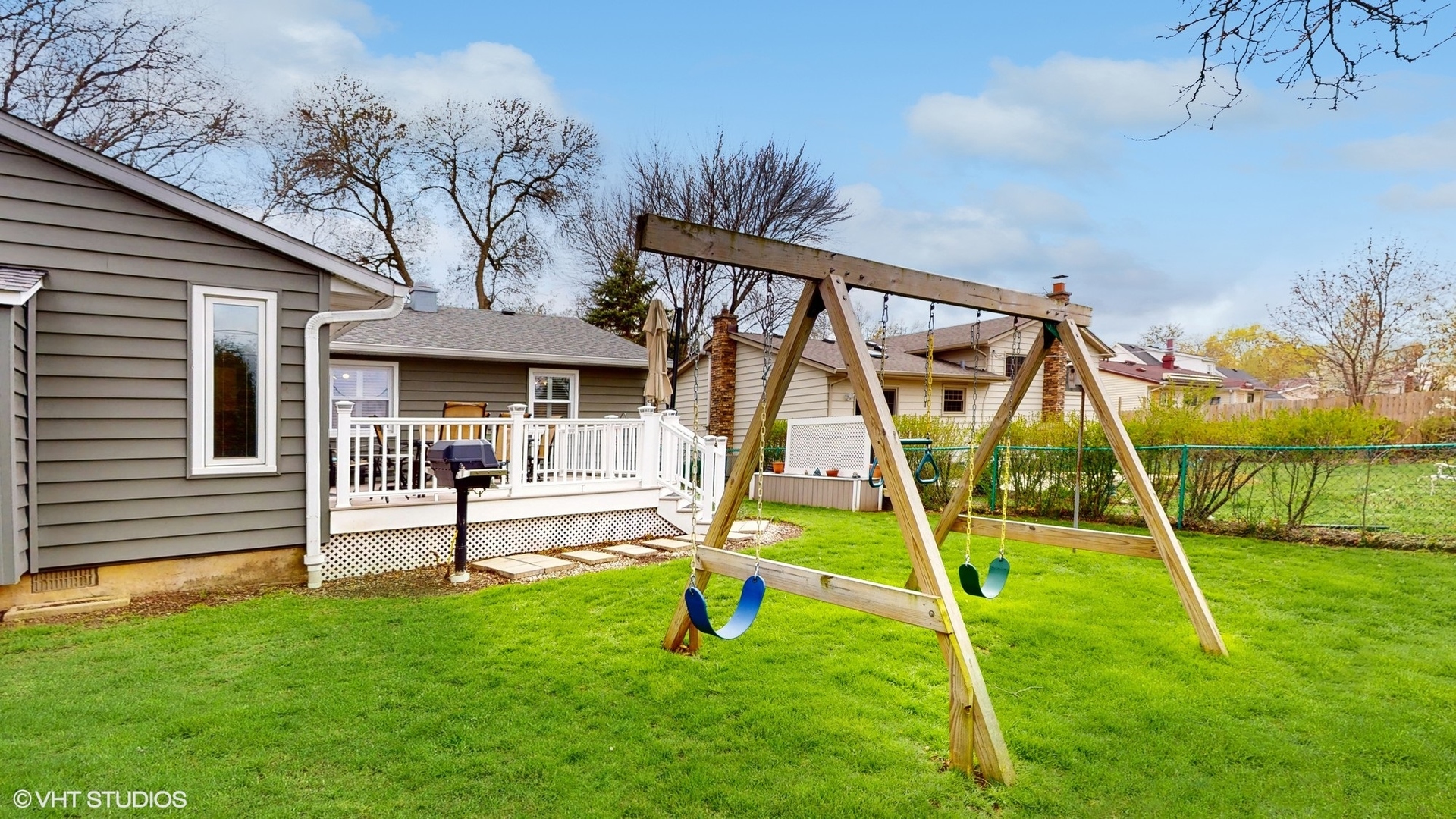 48 Lloyd Street Cary, IL 60013 - Photo 46 of 62 a view of an house with backyard and a slide