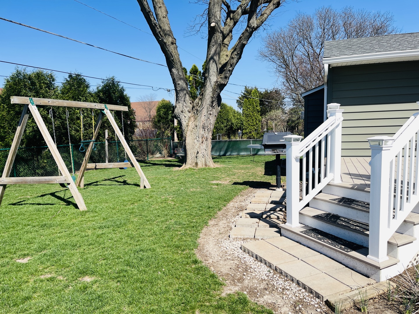 48 Lloyd Street Cary, IL 60013 - Photo 48 of 62 a view of a backyard with a wooden fence