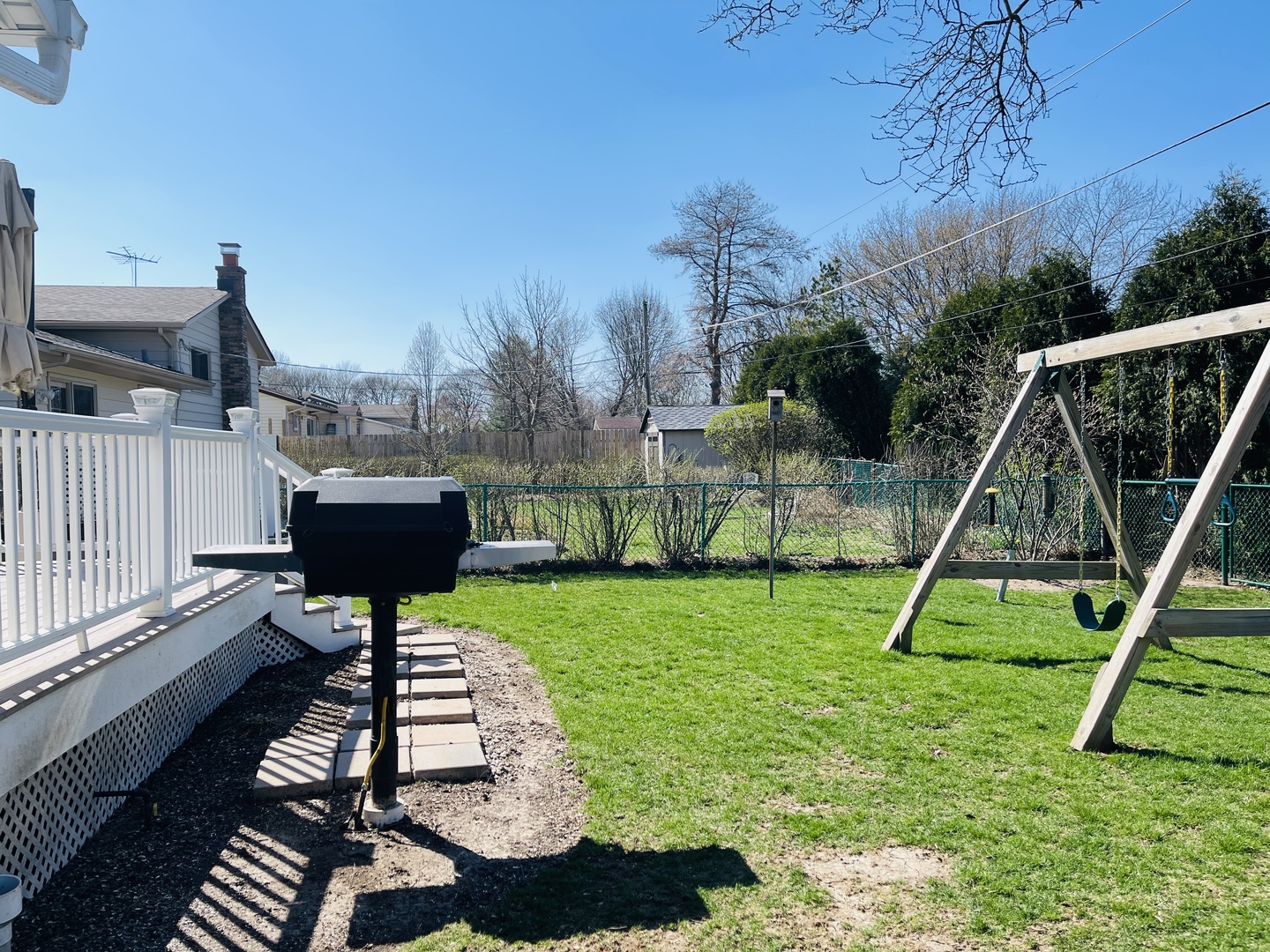 48 Lloyd Street Cary, IL 60013 - Photo 55 of 62 a view of a chair and tables in the back yard of the house
