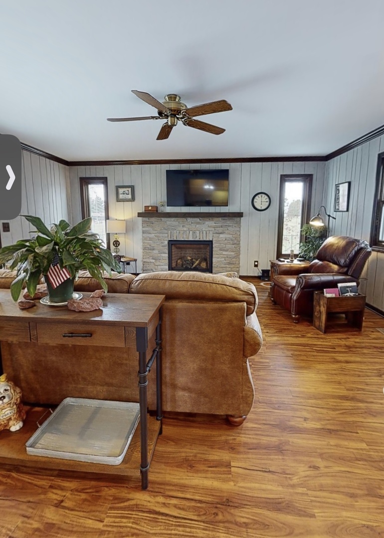 48 Lloyd Street Cary, IL 60013 - Photo 9 of 62 a living room with furniture and a fireplace