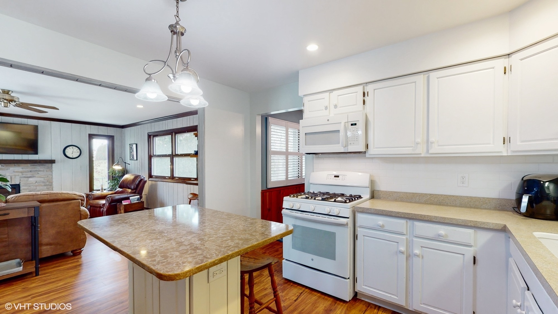 48 Lloyd Street Cary, IL 60013 - Photo 10 of 62 a kitchen with stainless steel appliances granite countertop a stove refrigerator and cabinets