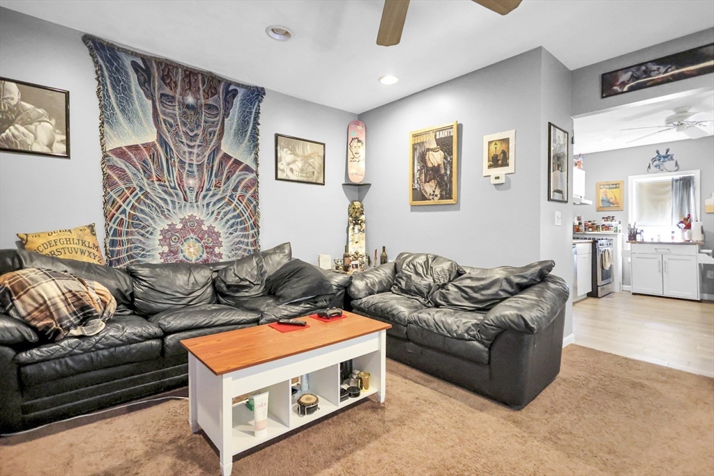 26 Gage Street Methuen, MA 01844 - Photo 11 of 29 a living room with furniture and a flat screen tv