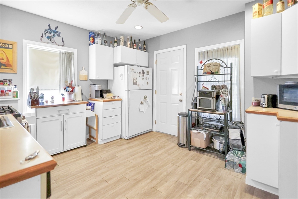 26 Gage Street Methuen, MA 01844 - Photo 12 of 29 a view of kitchen with cabinets and wooden floor
