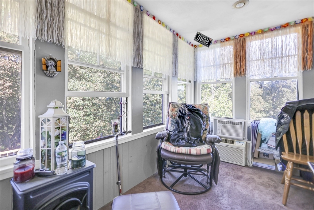 26 Gage Street Methuen, MA 01844 - Photo 18 of 29 a living room with furniture a flat screen tv and a large window