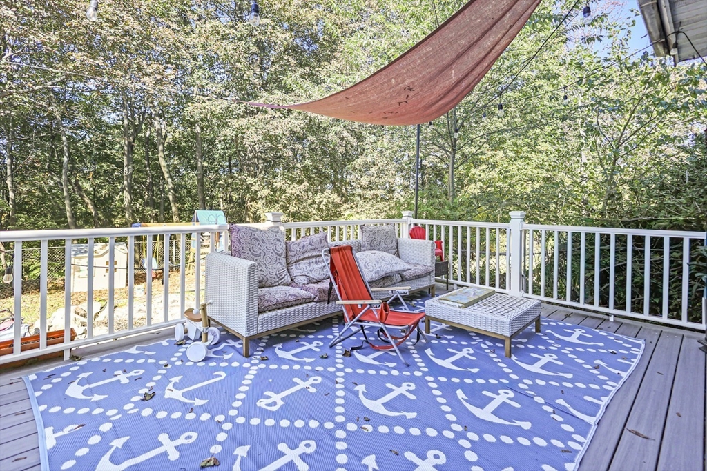 26 Gage Street Methuen, MA 01844 - Photo 26 of 29 a roof deck with couches and wooden floor