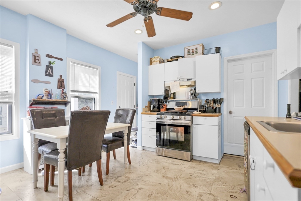 26 Gage Street Methuen, MA 01844 - Photo 5 of 29 a kitchen with cabinets and chairs