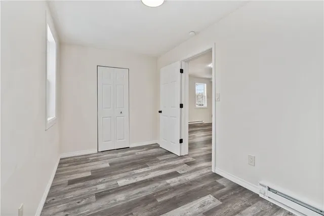 a view of a bathroom with wooden floor
