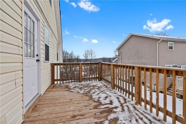 a view of a balcony with wooden floor