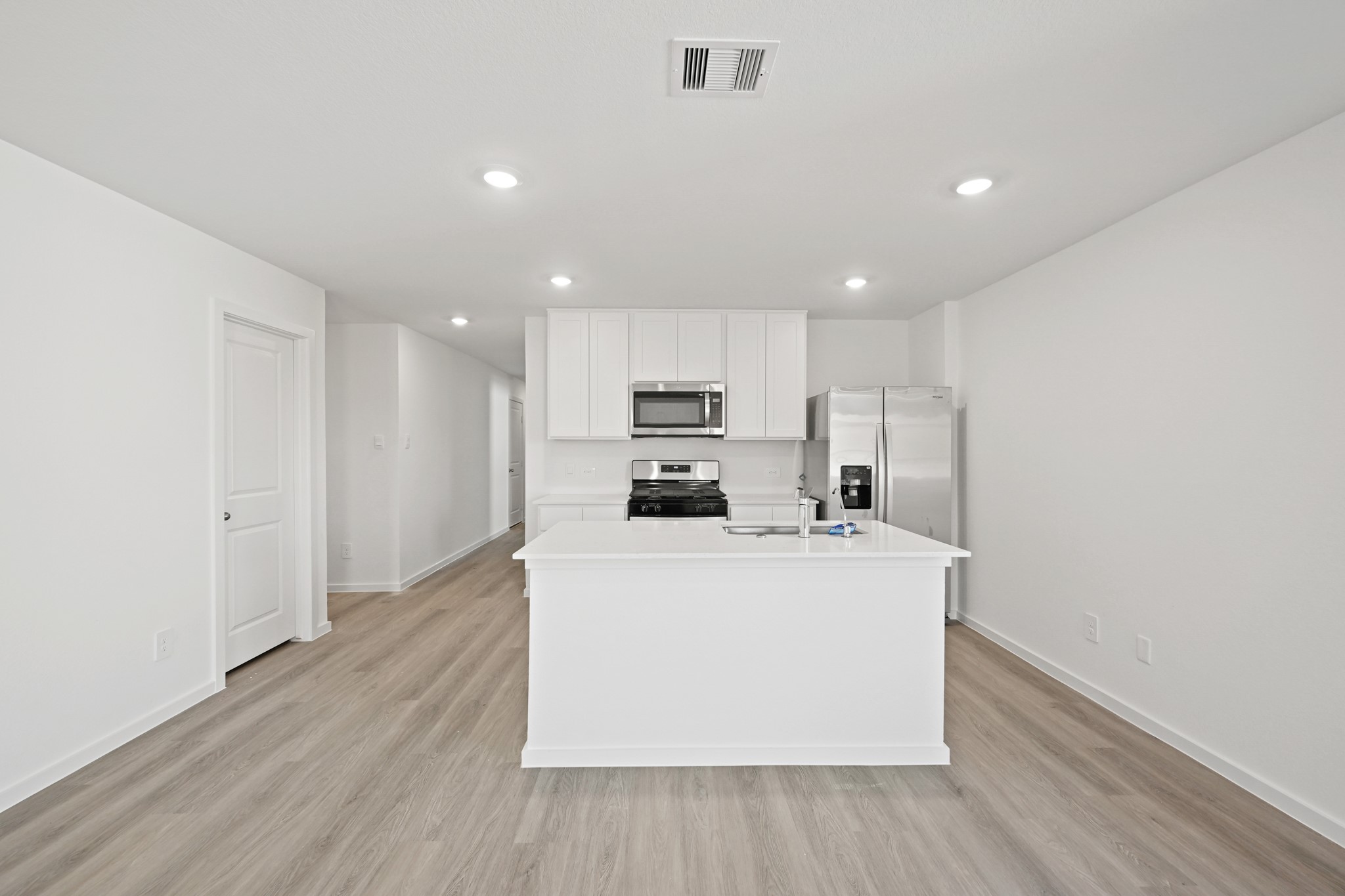 3032 Fall Gold Lane Katy, TX 77493 - Photo 2 of 24 a kitchen with stainless steel appliances a refrigerator and a stove top oven
