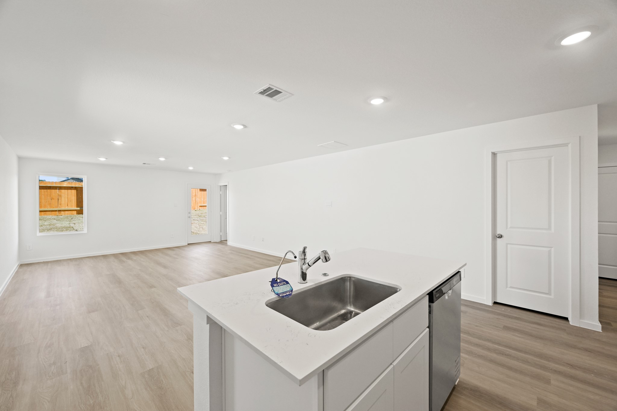 3032 Fall Gold Lane Katy, TX 77493 - Photo 4 of 24 a view of a sink and dishwasher with wooden floor