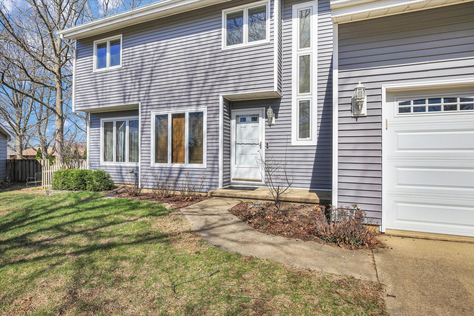4 Genevieve Lane Champaign, IL 61822 - Photo 14 of 54 a front view of a house with a yard