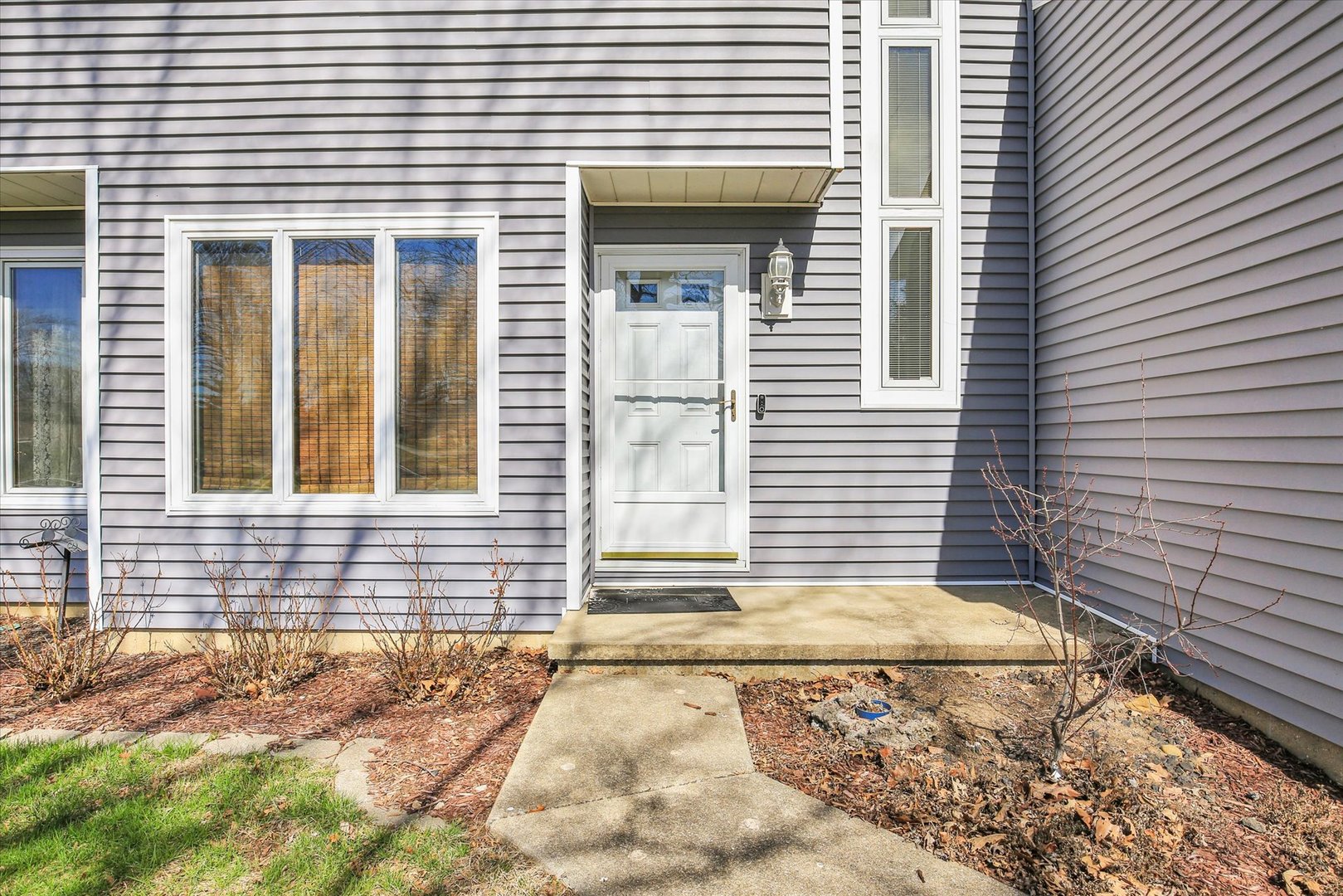 4 Genevieve Lane Champaign, IL 61822 - Photo 15 of 54 a view of a house with a door and a outdoor space