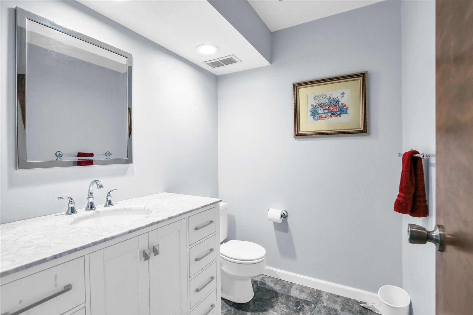 4 Genevieve Lane Champaign, IL 61822 - Photo 26 of 54 a bathroom with a toilet a sink and mirror