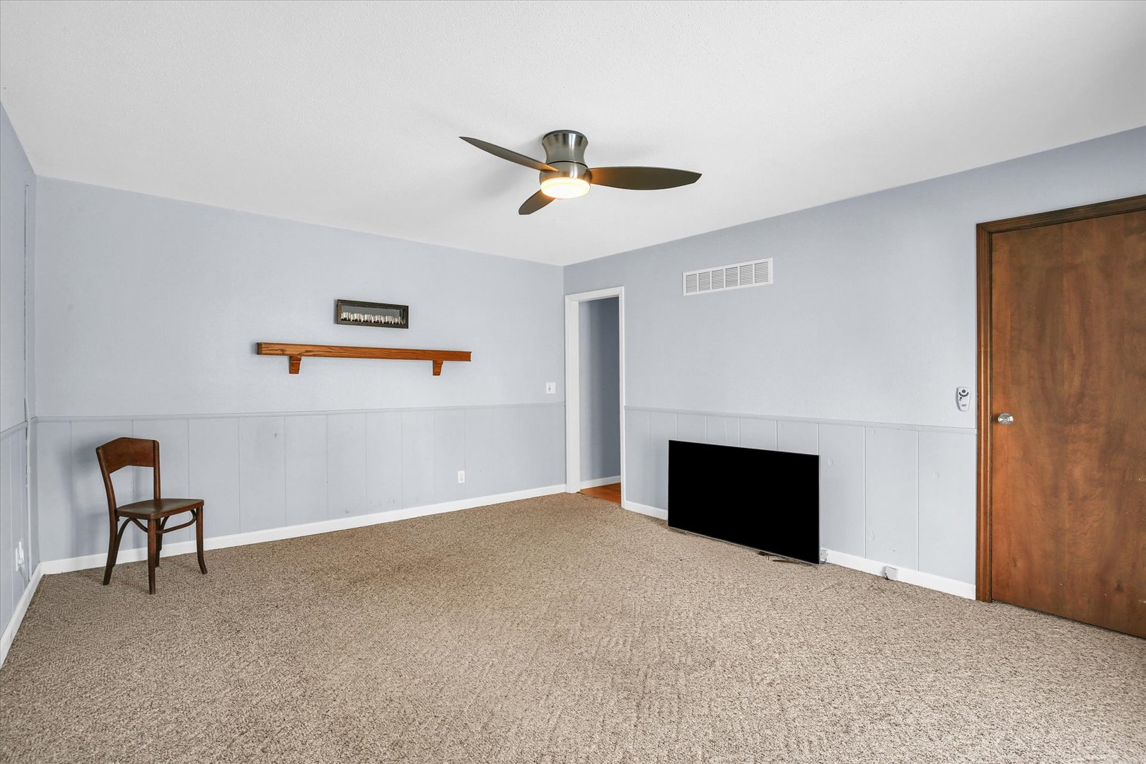 4 Genevieve Lane Champaign, IL 61822 - Photo 27 of 54 a view of a livingroom with a ceiling fan and window