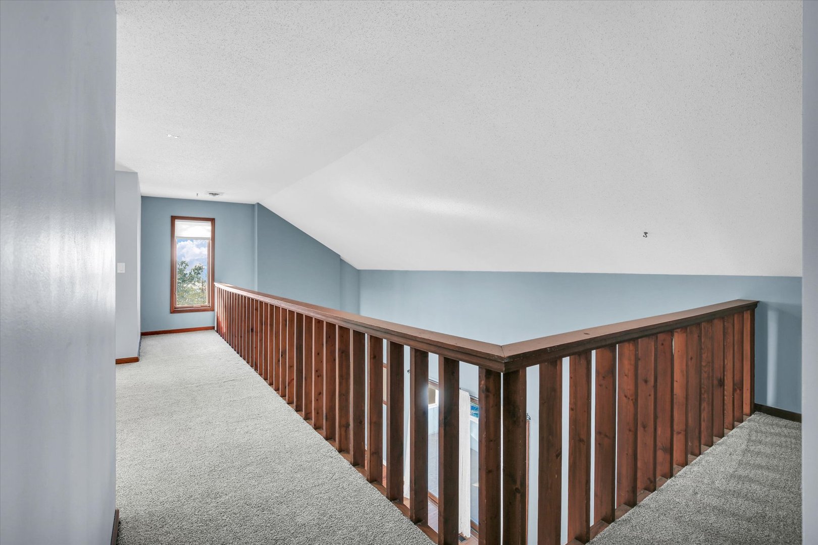 4 Genevieve Lane Champaign, IL 61822 - Photo 29 of 54 a view of a hallway with wooden floor and stairs