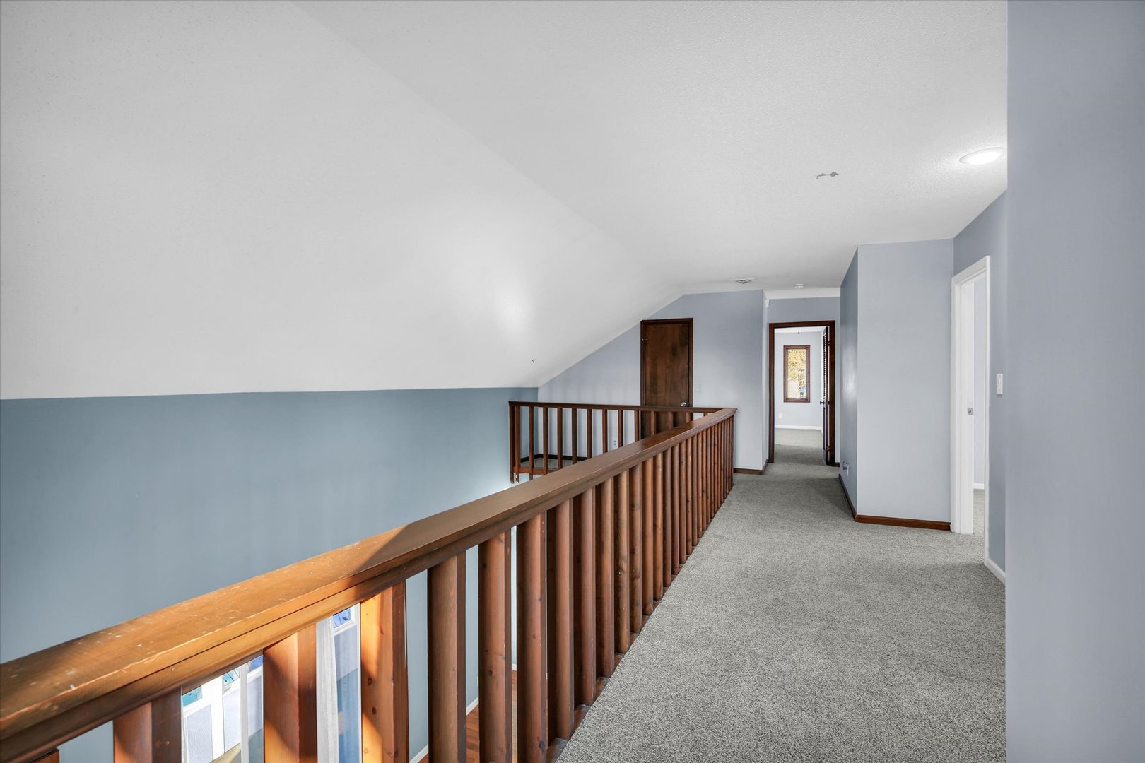 4 Genevieve Lane Champaign, IL 61822 - Photo 31 of 54 a view of a hallway with wooden floor and windows
