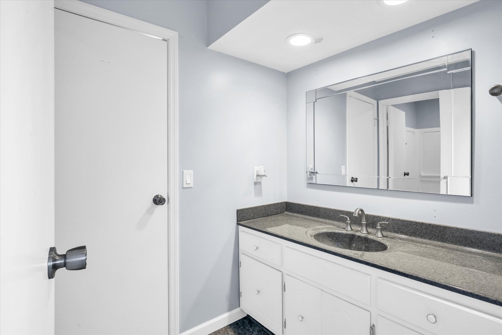 4 Genevieve Lane Champaign, IL 61822 - Photo 40 of 54 a bathroom with a sink and a mirror