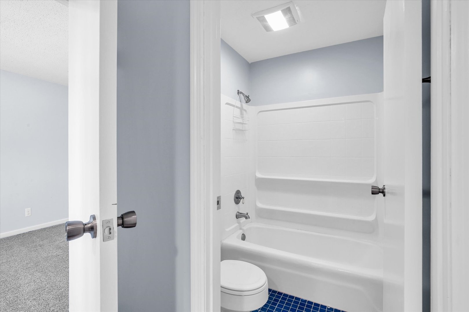 4 Genevieve Lane Champaign, IL 61822 - Photo 41 of 54 a bathroom with a shower a toilet and a glass door