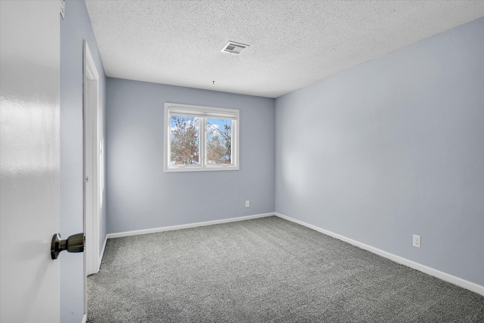 4 Genevieve Lane Champaign, IL 61822 - Photo 42 of 54 an empty room with windows