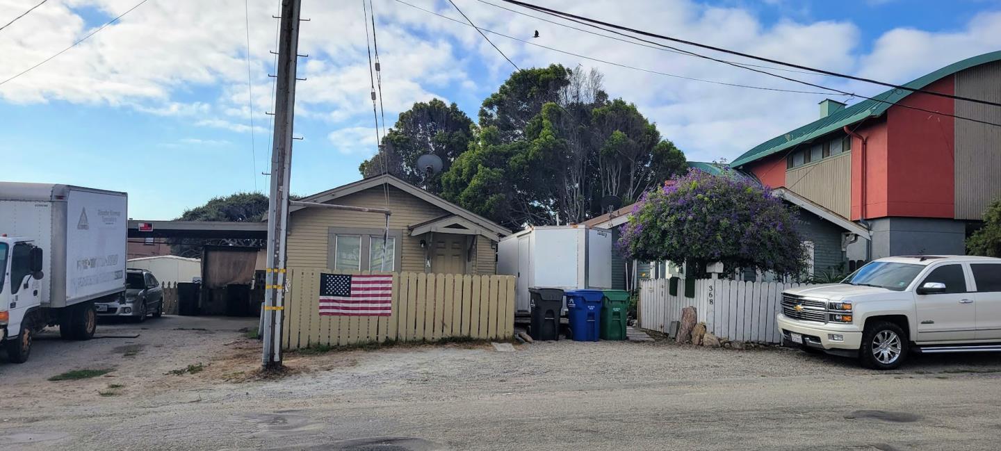 a view of a car park in front of house
