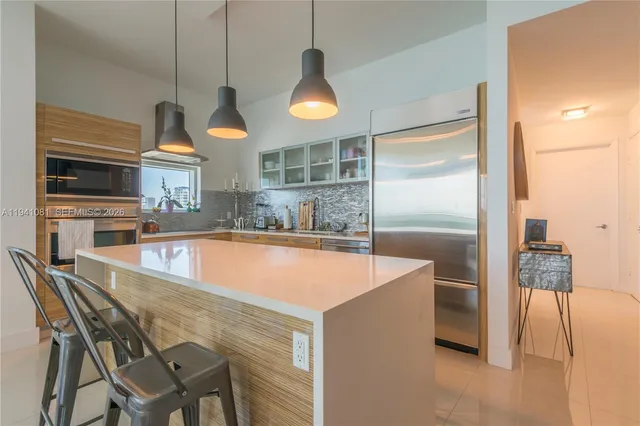 a kitchen with a table and chairs in it