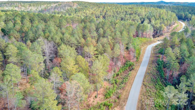 a view of a lake with a house in the background