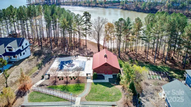 a front view of a house with a yard table and chairs