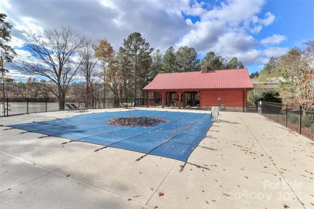 a view of a house with wooden fence