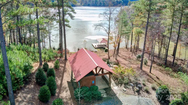 an aerial view of house with yard swimming pool and outdoor seating