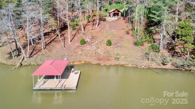 an aerial view of residential houses with outdoor space and swimming pool
