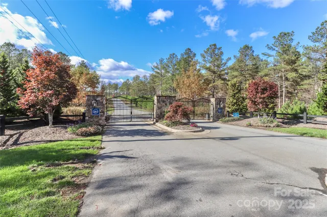 a view of a fountain with a house in the background