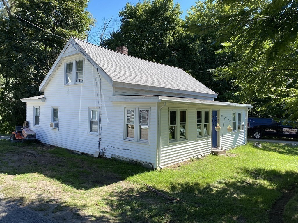 601 Main Street Bolton, MA 01740 - Photo 4 of 22 a view of a house with backyard and sitting area