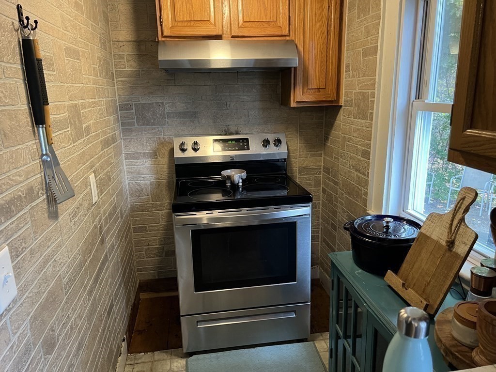 601 Main Street Bolton, MA 01740 - Photo 8 of 22 a kitchen with a stove and a microwave
