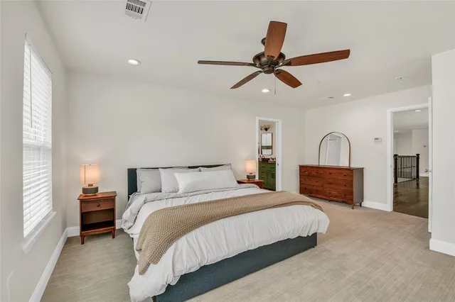 a bathroom with a double vanity sink mirror and bathtub