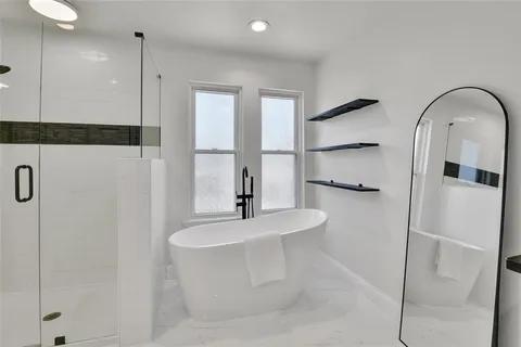 a bathroom with a bathtub and a sink