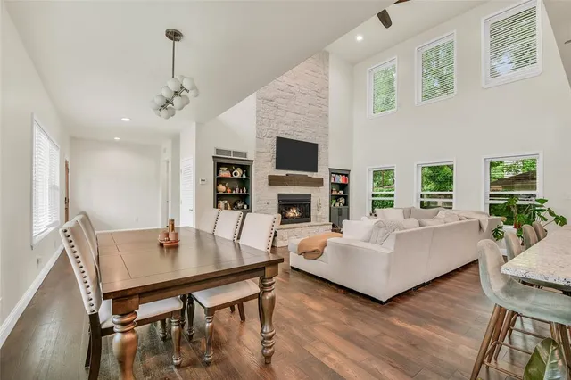 a living room with fireplace furniture and a wooden floor