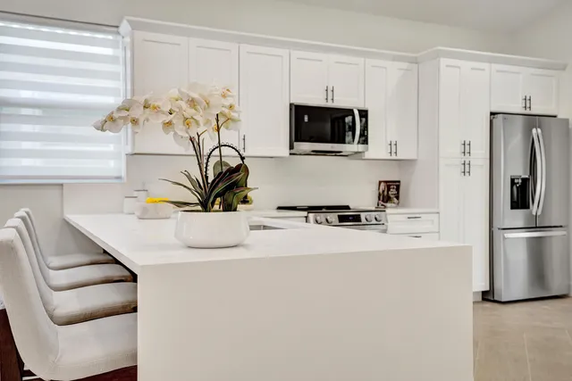 a bathroom with a sink mirror and toilet