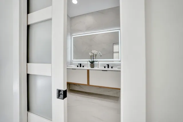 a view of a room with a large window and a yard