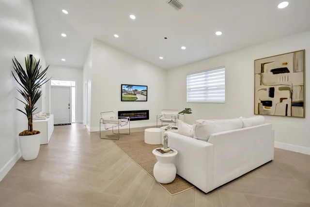 a kitchen with stainless steel appliances granite countertop a sink and cabinets