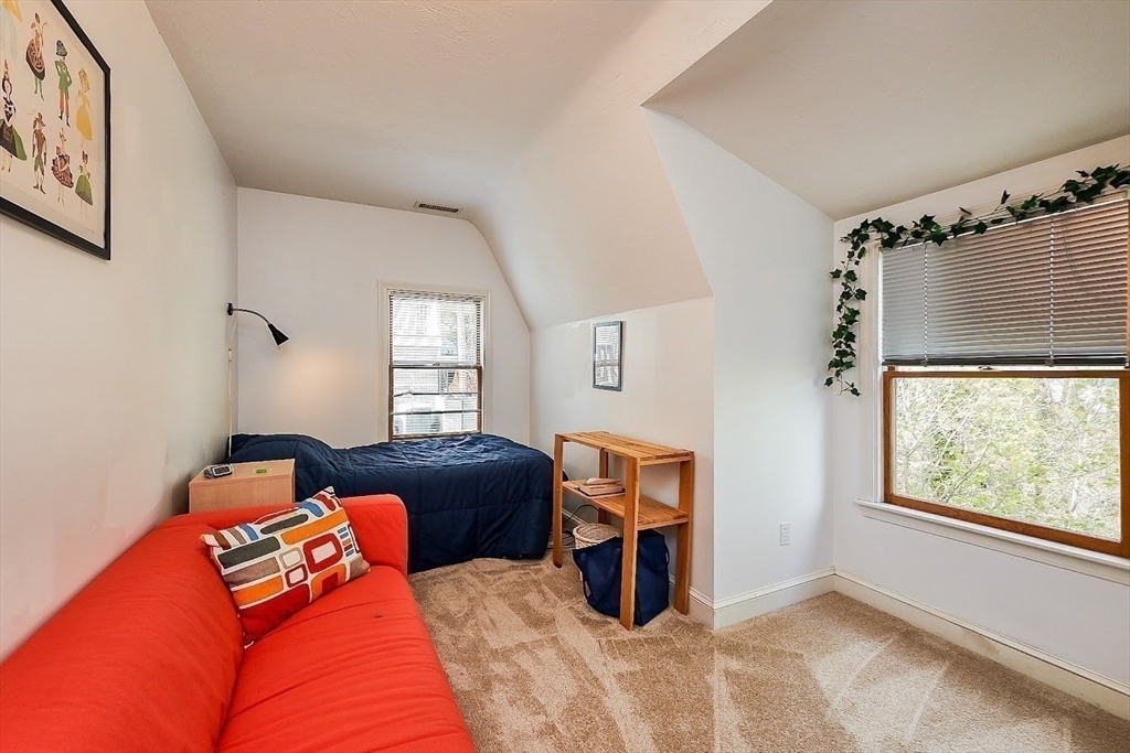 32 Mason Terrace, Unit 2 Brookline, MA 02446 - Photo 8 of 18 a bedroom with a bed and window