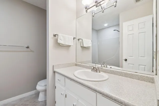 a bathroom with a bath tub with a shower