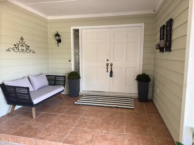 a view of a bedroom with furniture